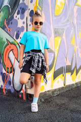 portrait of a girl on the background of graffiti
