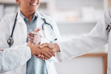 Clapping, teamwork or doctors shaking hands for success, good job or promotion goal in a hospital meeting. Closeup, congratulations or proud healthcare worker with handshake for medical collaboration