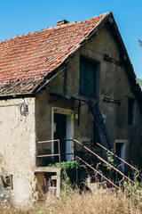 Old abandoned house of the 19th century in the village of Acquabianca, Italy