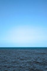 Obraz premium Riohacha, Colombia - January 2 2023: blue sky with multicolor sea