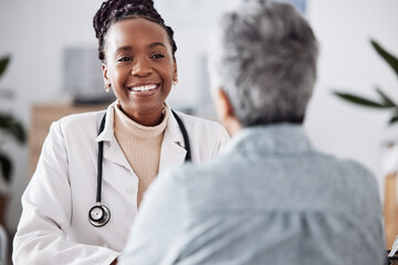 Happy, black woman or doctor consulting a patient in meeting in hospital for healthcare feedback or...