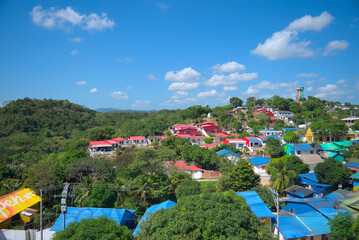 Usiacuri, Colombia - January 4 2023: Aerial panorama of Usiacuri, Colombia at noon with  colorful houses and rooftops
