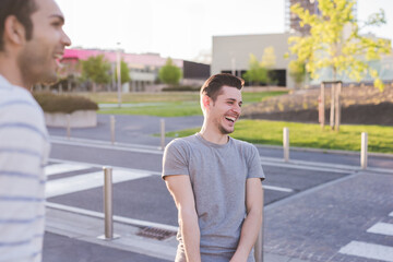 Young caucasian serene man outdoors carefree having fun laughing