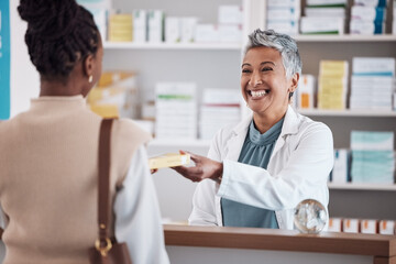 Pharmacist, medicine or happy woman giving package to patient in customer services help desk. Pharmacy, smile or mature doctor with medical product, pills or supplements in retail healthcare clinic