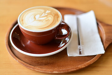 high angle view of coffee cup on wood grain table Drinking Concept: Hot Coffee, Latte, Espresso, Cappuccino