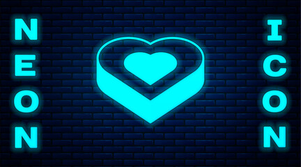 Glowing neon Candy in heart shaped box icon isolated on brick wall background. Valentines Day. Vector