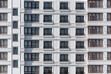 Fototapeta na wymiar walls and empty windows of new modern houses in Ukraine