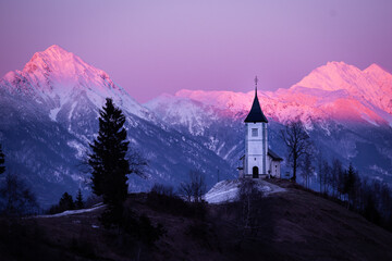 Jamnik church (Slovenia) with Kamnik-Savinja Alps in background