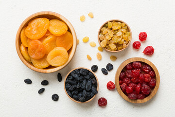 Bowl with different dried fruits on table background, top view. Healthy lifestyle with copy space