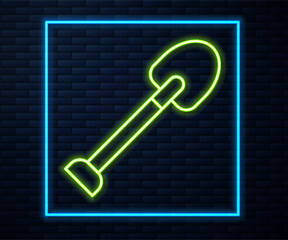 Glowing neon line Shovel icon isolated on brick wall background. Gardening tool. Tool for horticulture, agriculture, farming. Vector