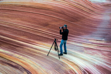 Photographer in action in a desert