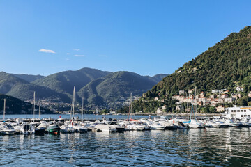 Fototapeta na wymiar Como, Italy - August 8, 2023: Port near the town of Como in Italy on the lake of the same name
