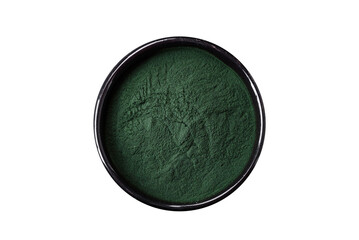 Spice, green color spirulina in the form of powder in a black bowl