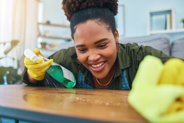 Smile, woman and cleaning table with gloves, spray bottle and soap detergent, housekeeping in home...