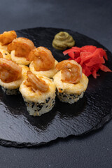 Delicious rolls on a dark background. Japanese cuisine. Close up  