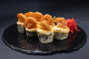 Delicious rolls on a dark background. Japanese cuisine. Close up  