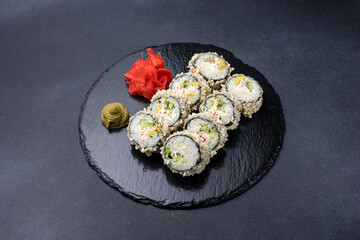 Delicious rolls on a dark background. Japanese cuisine. Close up  