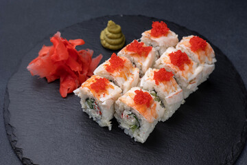 Delicious rolls on a dark background. Japanese cuisine. Close up  