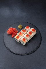 Delicious rolls on a dark background. Japanese cuisine. Close up  