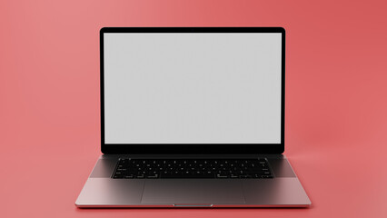Modern laptop with green screen on display for chromakeying and placing content. Laptop in front of mint red background