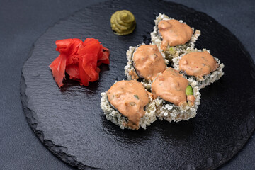 Delicious rolls on a dark background. Japanese cuisine. Close up  