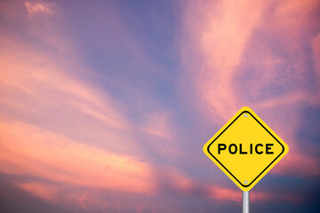 Yellow transportation sign with word police on violet color sky background