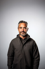 Obraz premium Smiling middle-aged man with beard, wearing jacket portrait
