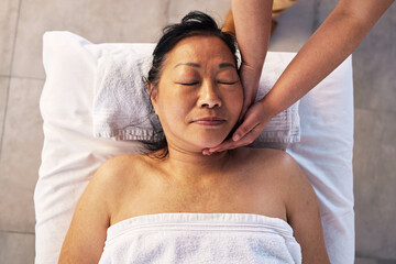 Facial, head massage and senior with woman in spa for wellness, treatment and hospitality. Peace,...