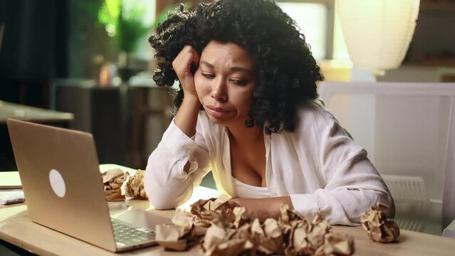 Portrait of exhausted young woman with failed ideas while take a break at home Tired female with creative block or lack of inspiration indoors