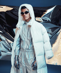 Holographic, vaporwave clothes and man with fashion and futuristic ski style with sci fi in studio....