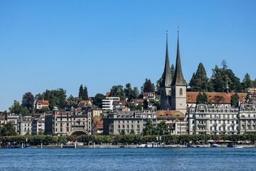 Fototapeta na wymiar Lucerne, Switzerland - August 10, 2023: View of downtown Lucerne in Switzerland on a sunny summer day