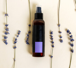 spray with lavender threads surrounded on surface,flat lay front view product photography. spray for pillow to sleep well