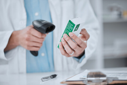 Person, pharmacist and hands scanning box in price check, inventory or inspection on medication at pharmacy. Closeup of medical or healthcare employee checking cost on pharmaceutical product or drug