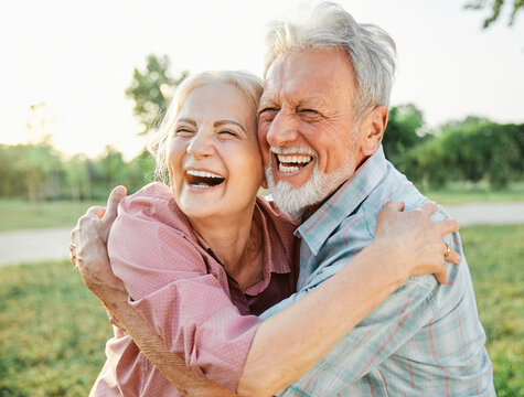 woman man senior couple happy retirement together elderly active vitality park fun smiling love old nature wife happiness mature hug park outdoor