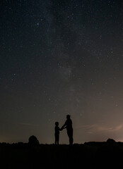 Mother and son under the stars