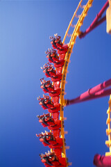 People riding a rollercoaster in an amusement park