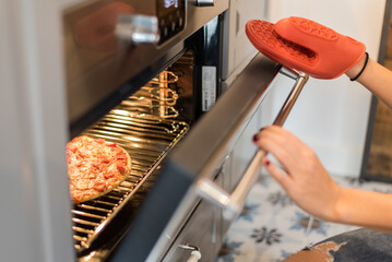 Pizza cooking in a modern beautiful oven