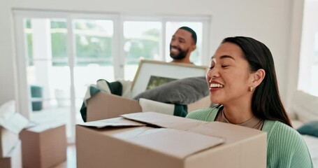 Happy couple, box and moving in real estate, new home or financial investment and relocation together. Excited man and woman walking with boxes in property, building or house for start or renovation