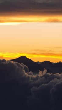 Vertical video - Timelapse of rolling clouds after sunset
