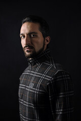 Naklejka premium Male portrait on a dark background.