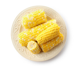 Plate with boiled corn cobs on white background