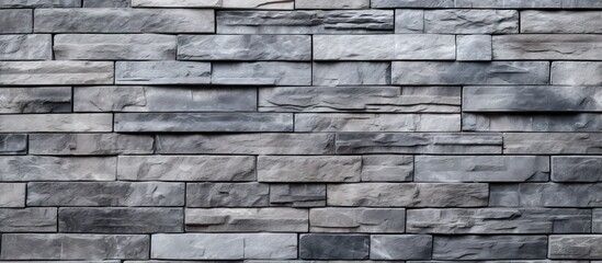 The texture of a gray brick wall is fitting as a backdrop