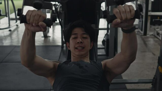 Pec Deck Fly Machine, Men exercise to increase chest muscles, Building Forearm Strength, Bodybuilders Intense Gym Workout with Weight Machine.