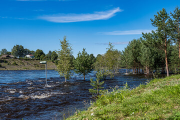 Hydropower station opens its gates fully after major problems with high amounts of rain as a result of which the walkway by the river was flooded Sweden August 2023