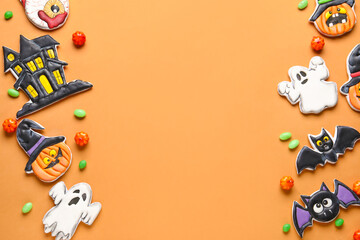 Composition with different tasty cookies and candies for Halloween celebration on beige background