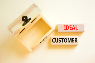 Ideal customer symbol. Concept words Ideal customer on beautiful wooden blocks. Beautiful white table white background. Empty wooden chest. Business ideal customer concept. Copy space.