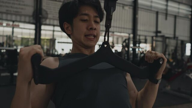 Pec Deck Fly Machine, Muscular Man Sculpting Arm Strength, Fitness Enthusiast Working Out, Powerful Arm Muscle Strengthening in Gym Workout Session, Fitness.