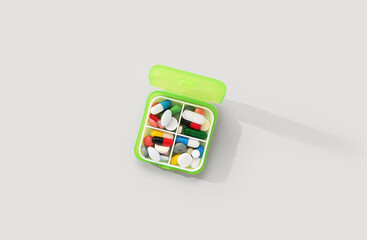 Container with different pills on grey background