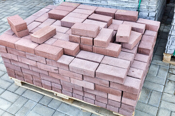 Fototapeta premium concrete paving slabs stacked on pallets outdoor of workshop