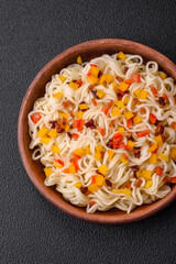 Delicious fresh Asian noodles with pieces of vegetables, meat, with salt, spices and herbs